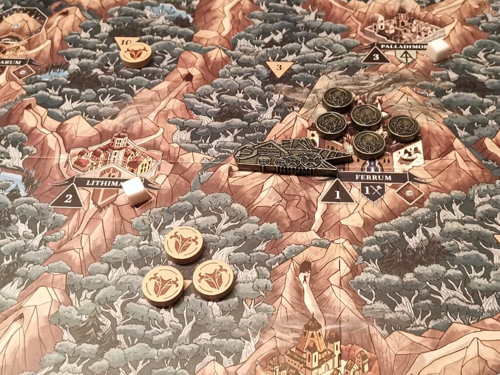 Une partie du plateau d'Ironwood avec les jetons en bois et en métal représentant les deux Factions